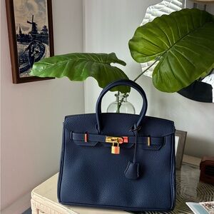 Elegant Navy Blue Handbag with Gold Accents wirkin style